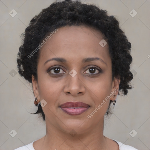 Joyful black young-adult female with medium  brown hair and brown eyes