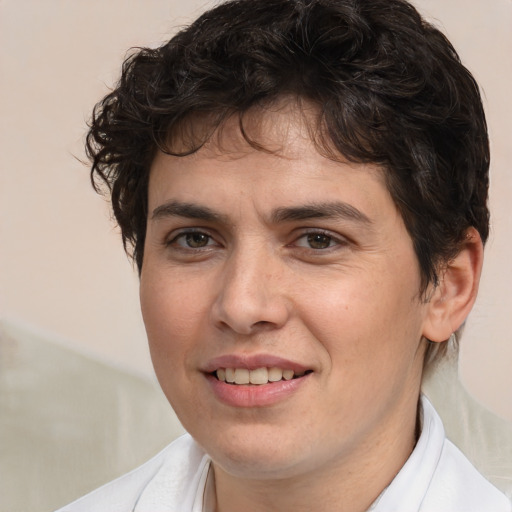 Joyful white young-adult male with medium  brown hair and brown eyes