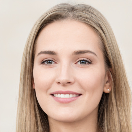 Joyful white young-adult female with long  brown hair and grey eyes