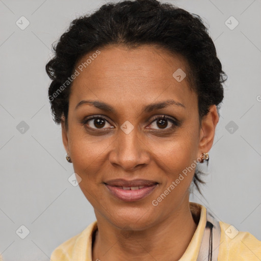 Joyful black adult female with short  brown hair and brown eyes
