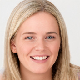 Joyful white young-adult female with long  brown hair and blue eyes