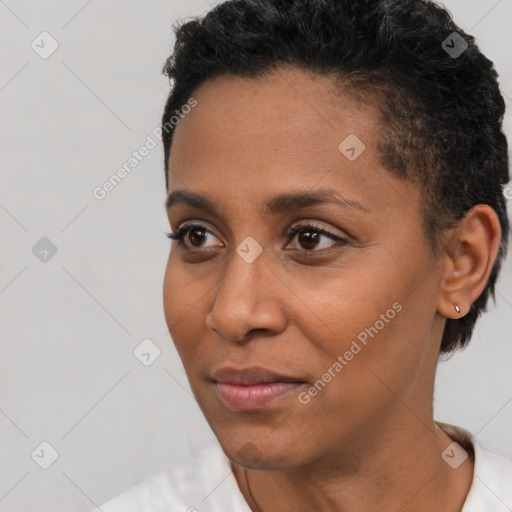 Joyful black young-adult female with short  brown hair and brown eyes