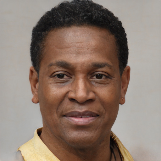 Joyful latino adult male with short  black hair and brown eyes