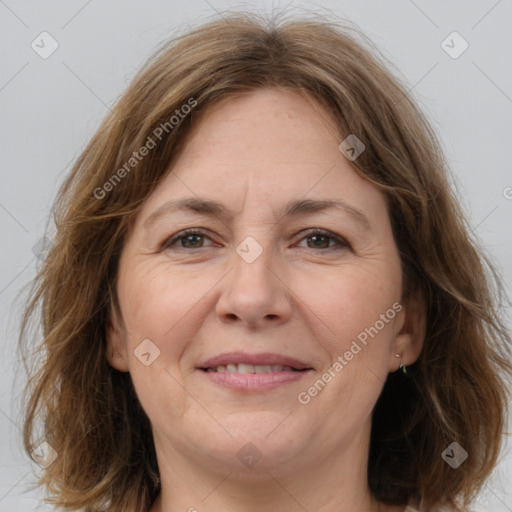 Joyful white adult female with medium  brown hair and brown eyes