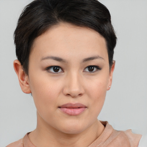 Joyful asian young-adult female with short  brown hair and brown eyes