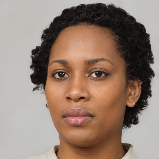 Neutral black young-adult female with short  black hair and brown eyes