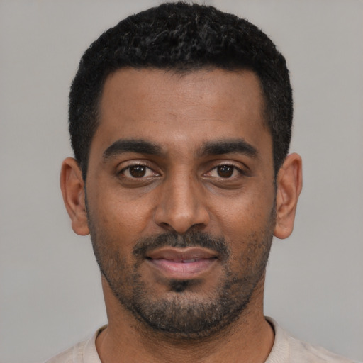 Neutral black young-adult male with short  black hair and brown eyes
