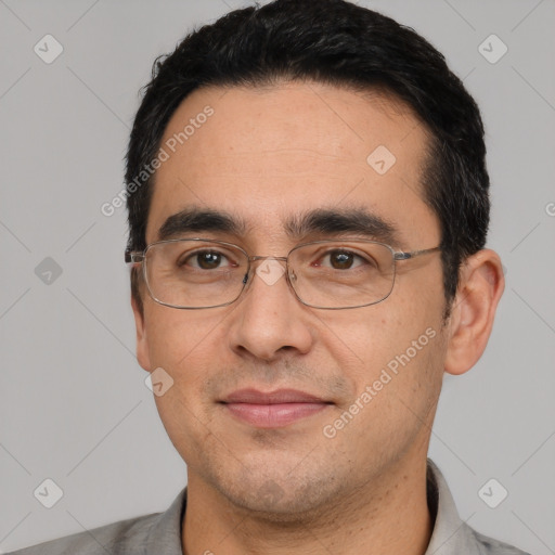 Joyful white adult male with short  black hair and brown eyes