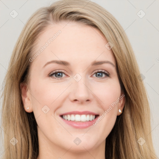 Joyful white young-adult female with long  brown hair and blue eyes