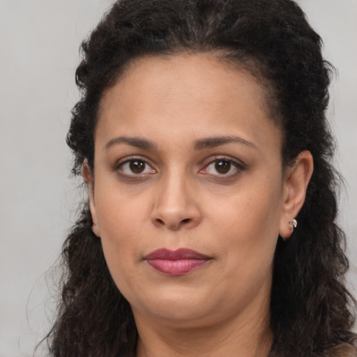 Neutral black adult female with long  brown hair and brown eyes