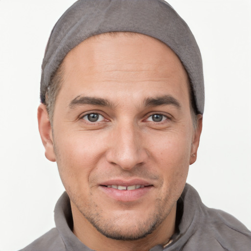 Joyful white adult male with short  brown hair and brown eyes