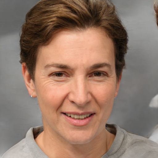 Joyful white adult female with short  brown hair and brown eyes