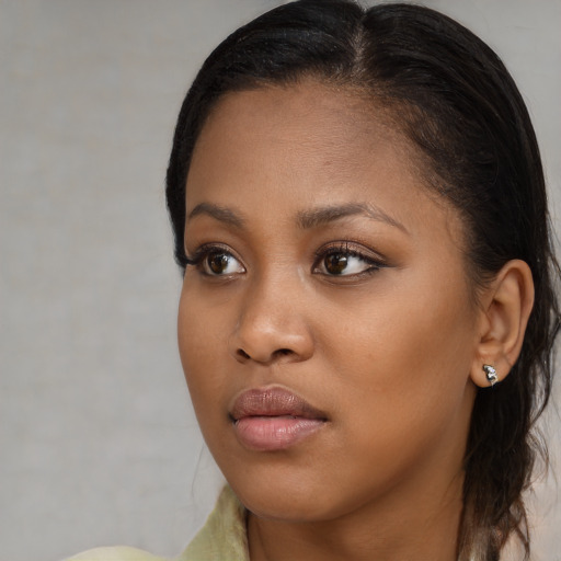 Neutral black young-adult female with long  brown hair and brown eyes