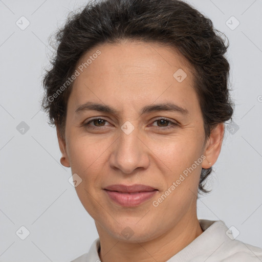 Joyful white adult female with short  brown hair and brown eyes