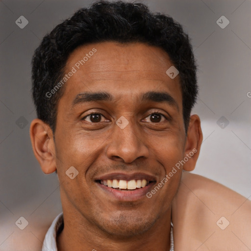 Joyful latino young-adult male with short  brown hair and brown eyes