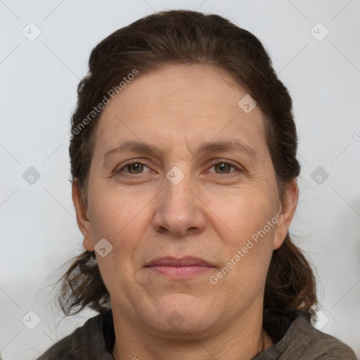 Joyful white adult female with medium  brown hair and grey eyes