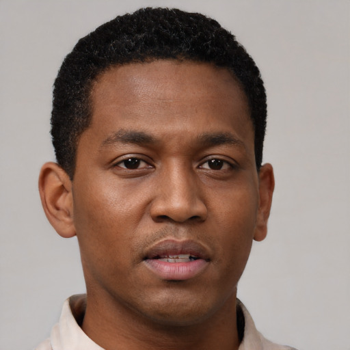 Neutral black young-adult male with short  black hair and brown eyes
