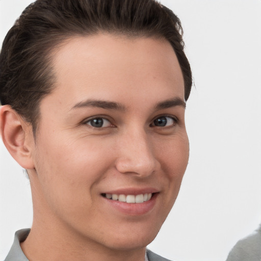 Joyful white young-adult female with short  brown hair and grey eyes