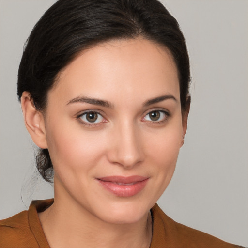 Joyful white young-adult female with medium  brown hair and brown eyes