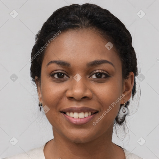 Joyful black young-adult female with medium  black hair and brown eyes