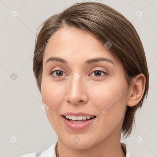 Joyful white young-adult female with medium  brown hair and brown eyes