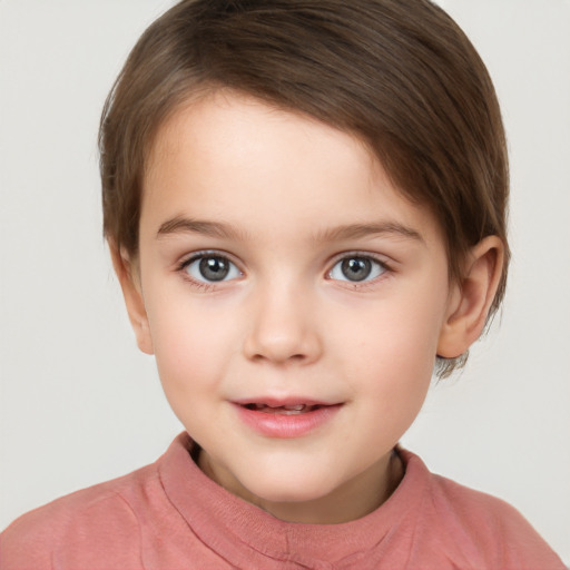 Joyful white child female with short  brown hair and brown eyes