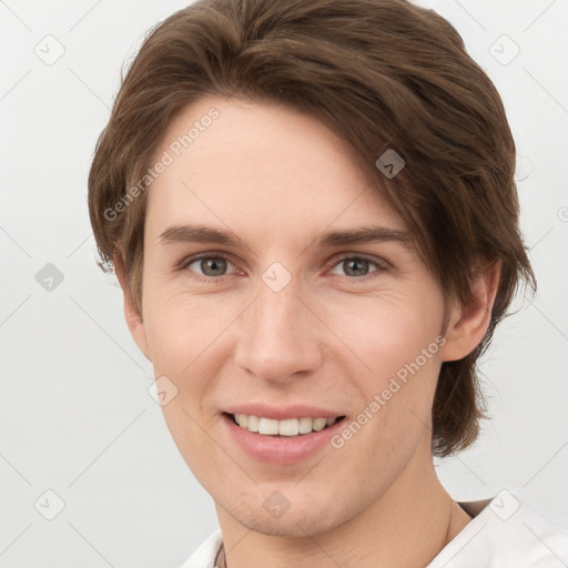 Joyful white young-adult female with short  brown hair and grey eyes