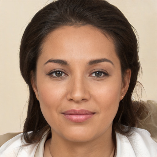 Joyful white young-adult female with medium  brown hair and brown eyes