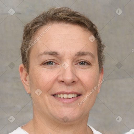 Joyful white adult female with short  brown hair and brown eyes