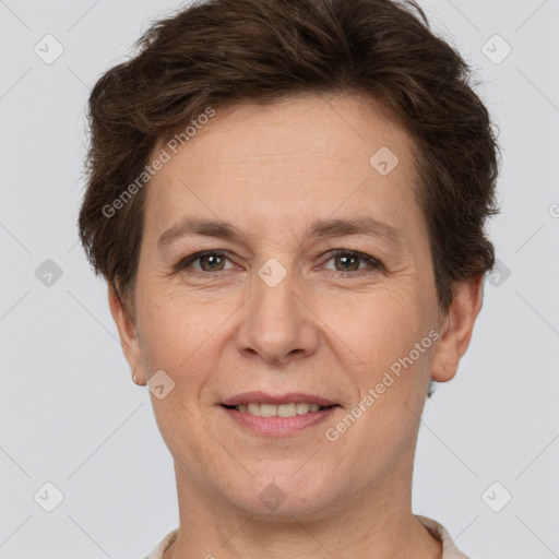 Joyful white adult female with short  brown hair and brown eyes