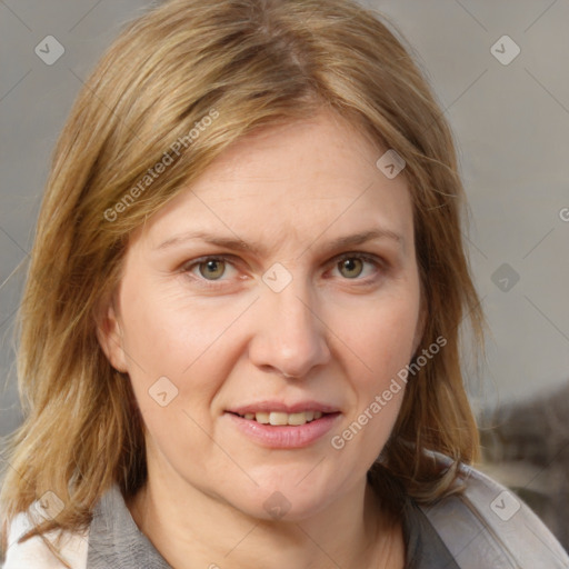 Joyful white adult female with medium  brown hair and grey eyes