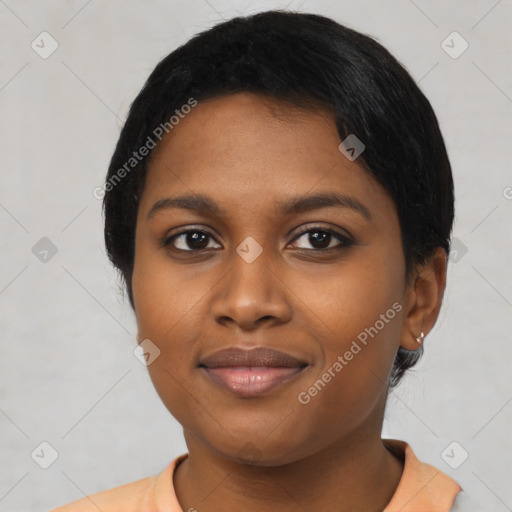 Joyful black young-adult female with short  black hair and brown eyes