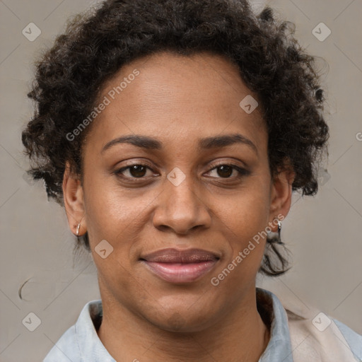 Joyful black adult female with short  brown hair and brown eyes