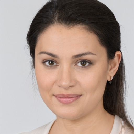 Joyful white young-adult female with medium  brown hair and brown eyes