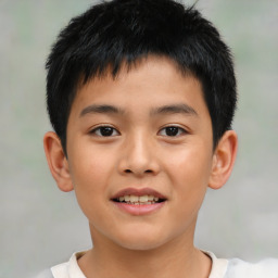 Joyful asian child male with short  brown hair and brown eyes