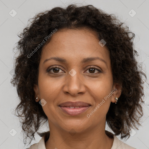 Joyful black young-adult female with medium  brown hair and brown eyes