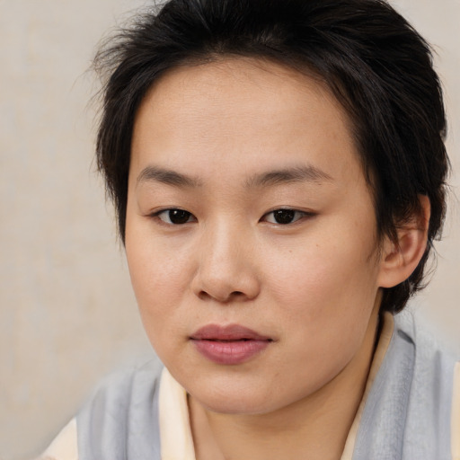 Joyful asian young-adult female with medium  brown hair and brown eyes