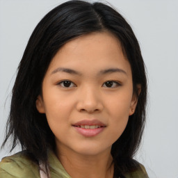 Joyful asian young-adult female with medium  black hair and brown eyes