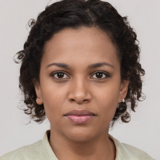 Neutral latino young-adult female with medium  brown hair and brown eyes
