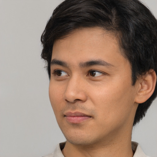 Neutral white young-adult male with short  black hair and brown eyes