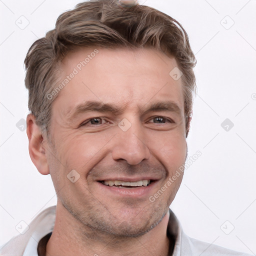 Joyful white adult male with short  brown hair and grey eyes