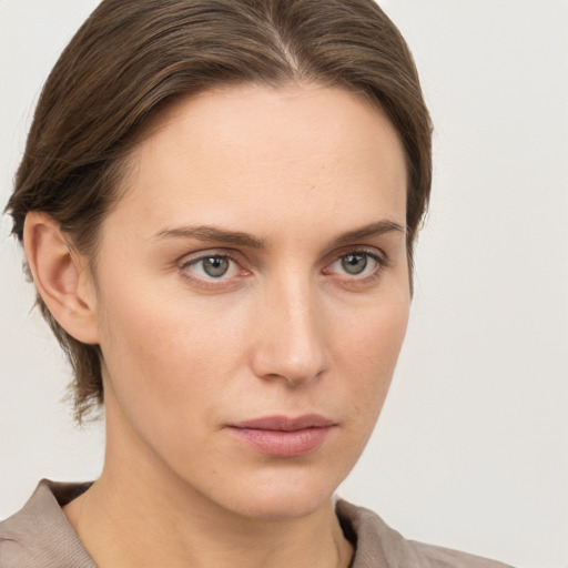 Neutral white young-adult female with medium  brown hair and grey eyes