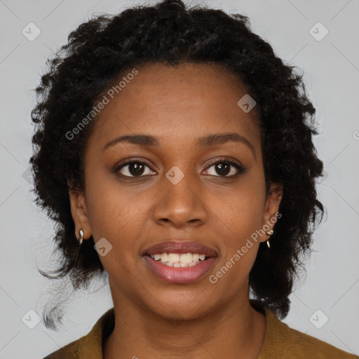 Joyful black young-adult female with long  brown hair and brown eyes