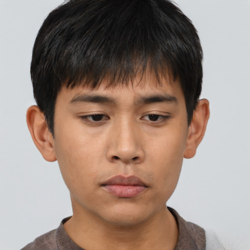 Neutral asian young-adult male with short  brown hair and brown eyes