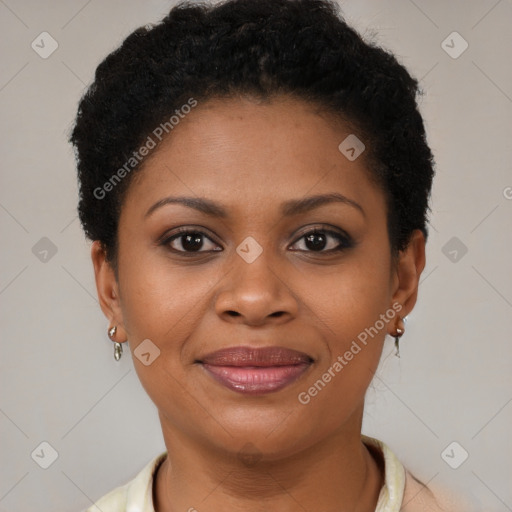 Joyful black young-adult female with short  brown hair and brown eyes