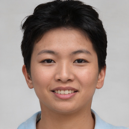 Joyful asian young-adult female with short  brown hair and brown eyes