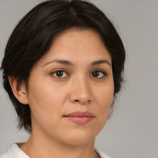 Joyful white young-adult female with medium  brown hair and brown eyes