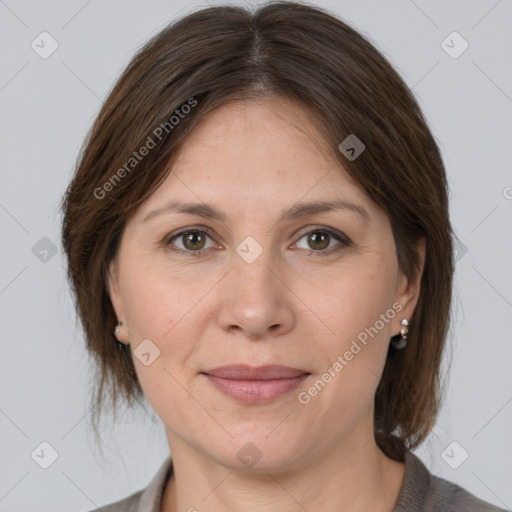 Joyful white adult female with medium  brown hair and brown eyes