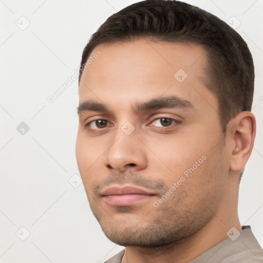 Neutral white young-adult male with short  brown hair and brown eyes