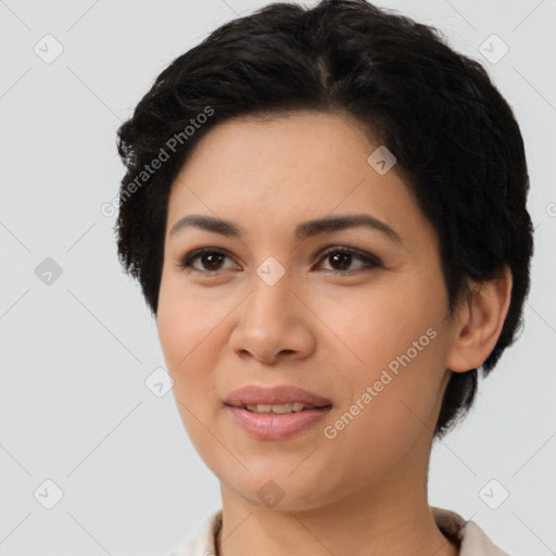 Joyful latino young-adult female with short  black hair and brown eyes